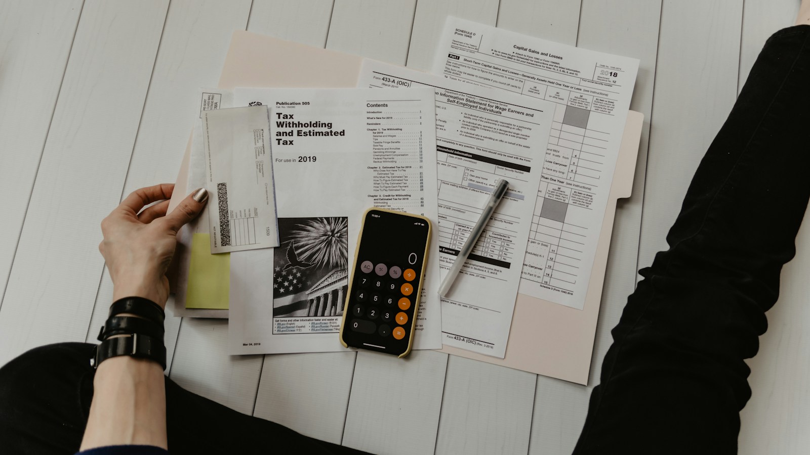 Canadian business accountant reviewing balance sheet and Form T2054 for Capital Dividend Account extraction